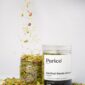Kanthari Kerala mixture with ingredients falling into jar
